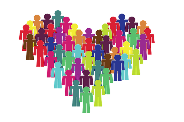 Colourful people templates forming a heart shape to represent inclusion